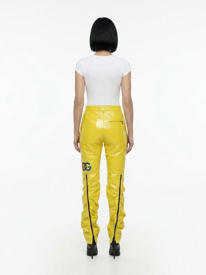 Trousers by Dolce & Gabbana for women in polyester yellow features an sartorial silhouette, showcasing a precise and long with a sartorial for a refined look.