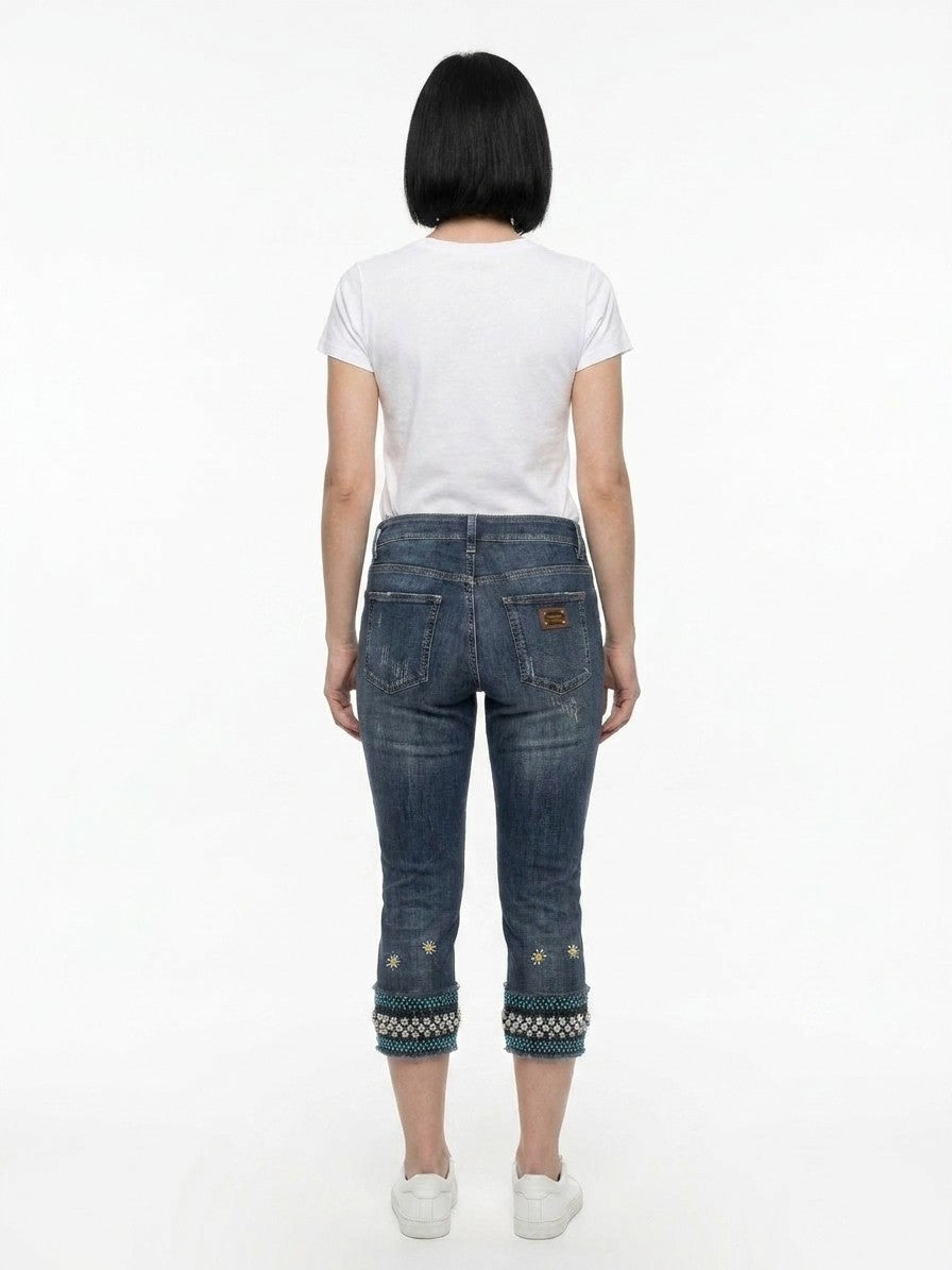 Jeans by Dolce & Gabbana for women in stretch denim cotton blue presents a refined pantology silhouette, artfully defined by a refined pantology cropped, cropped, and a sophisticated .