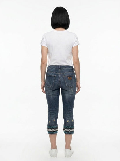 Jeans by Dolce & Gabbana for women in stretch denim cotton blue presents a refined pantology silhouette, artfully defined by a refined pantology cropped, cropped, and a sophisticated .