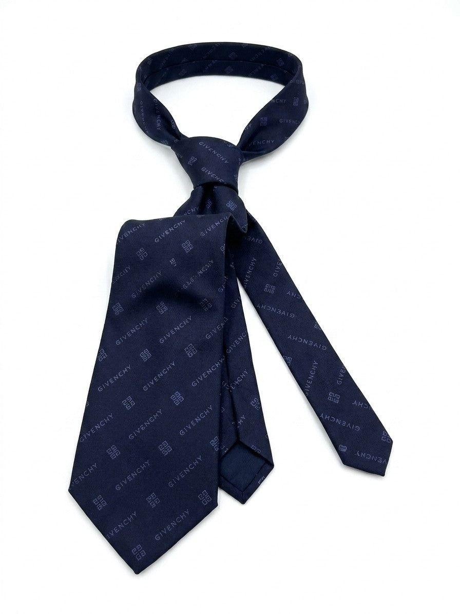 Necktie by Givenchy for men in silk blue features a distinguished silhouette, artfully capturing the essence of the distinguished Silk Necktie design for a sophisticated look.