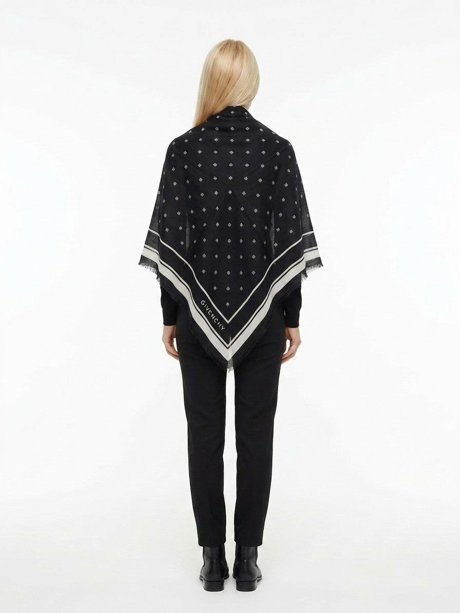 Scarf by Givenchy for women in cashmere silk bicolour features a snug silhouette, perfectly showcasing the elegant drape and premium finish of the Cashmere Silk Square Scarf.