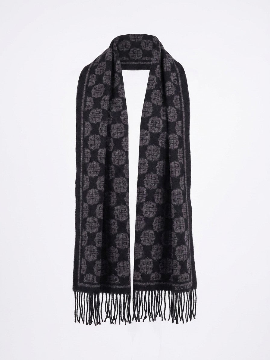Scarf by Givenchy for women in wool black showcases a warm silhouette from the Essence Wool Scarf collection, offering a warm drape that exudes sophisticated luxury.