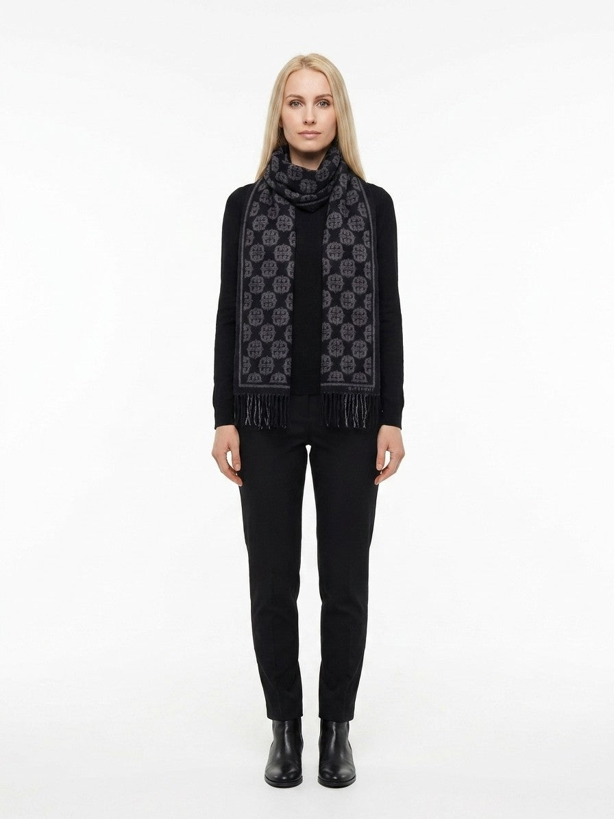 Scarf by Givenchy for women in wool black features a snug silhouette, perfectly showcasing the elegant drape and premium finish of the Essence Wool Scarf.