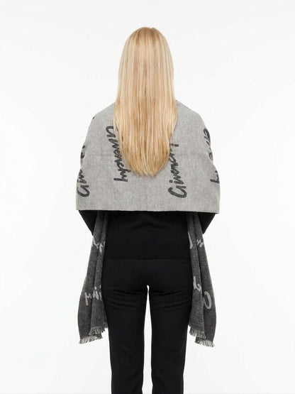 Scarf by Givenchy for women in wool & silk bicolour features a timeless silhouette, artfully capturing the essence of the timeless Wool & Silk Wrap Scarf design for a sophisticated look.