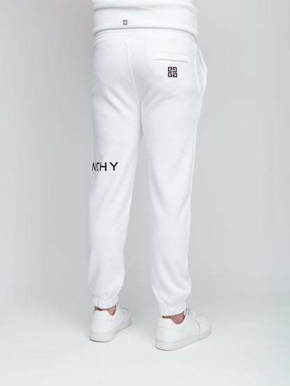 Joggers by Givenchy for men in cotton white presents a refined pantology silhouette, artfully defined by a refined pantology slim, long, and a sophisticated .