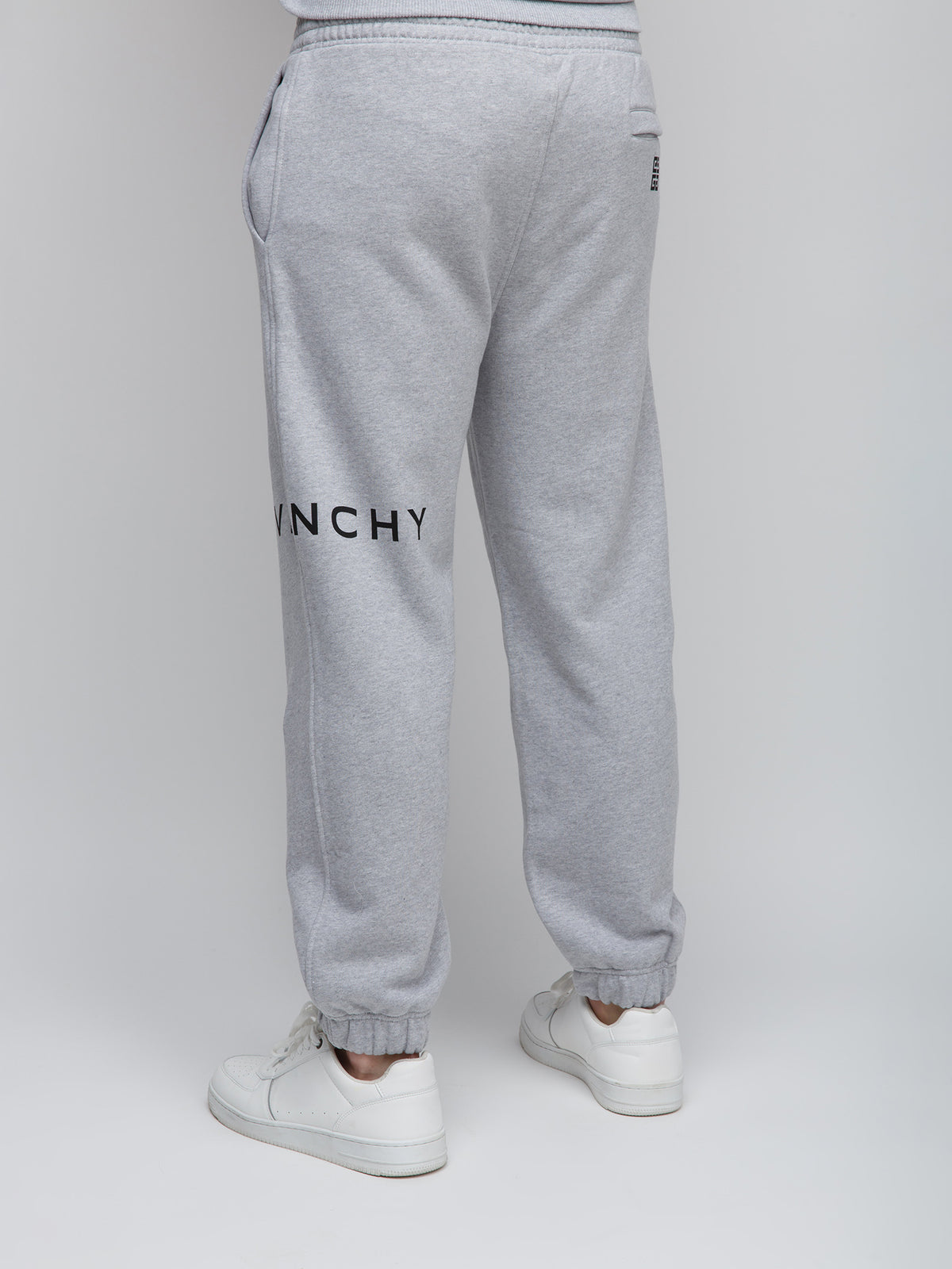 Joggers by Givenchy for men in cotton gray features an refined tailoring silhouette, showcasing a premium slim with a and long cut for a refined tailoring look.