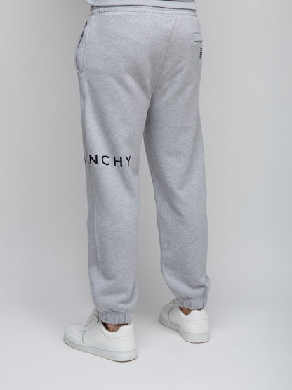 Joggers by Givenchy for men in cotton gray features an refined tailoring silhouette, showcasing a premium slim with a and long cut for a refined tailoring look.
