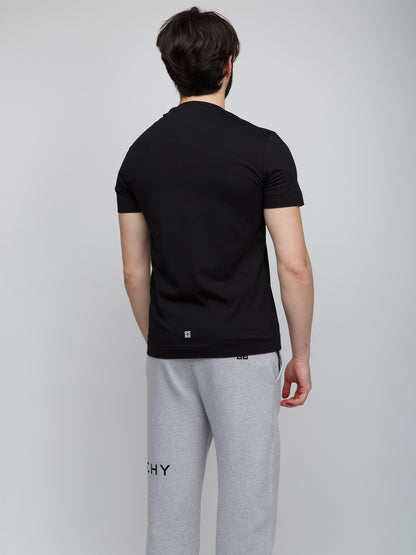 T-Shirt by Givenchy for men in cotton black features an on trend silhouette, perfectly showcasing a on trend and for an elevated aesthetic.