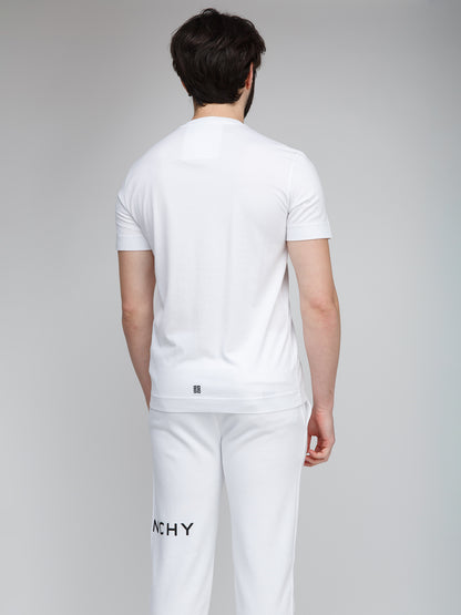 T-Shirt by Givenchy for men in cotton white features an on trend silhouette, perfectly showcasing a on trend and for an elevated aesthetic.