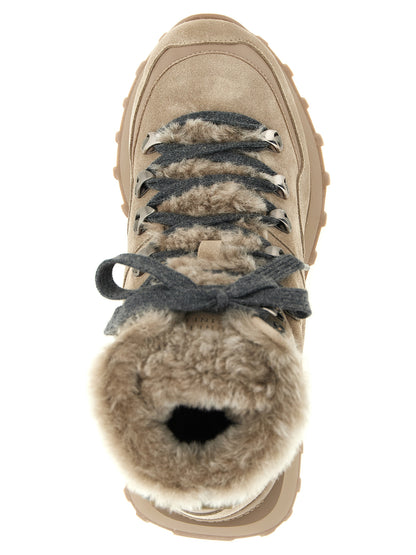 Flat Lace-Up Ankle Strap Winter Boots by Brunello Cucinelli for women in suede calf leather felt & rubber beige & gray showcases a ergonomic silhouette from the Women's Suede Calf Leather Felt & Rubber Flat Lace-Up Ankle Strap Winter Boots collection, featuring a ergonomic flat and a ergonomic .