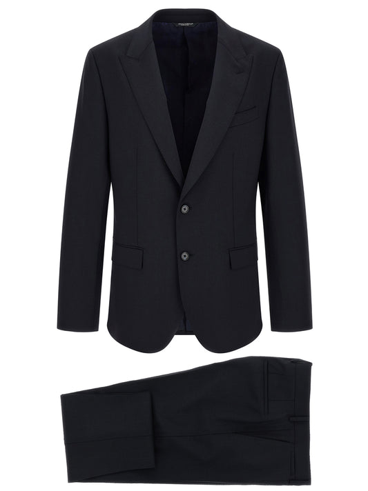 This Pant Suit by Dolce & Gabbana for men in virgin wool navy presents a discerning silhouette, featuring a sophisticated and a discerning for a refined and polished look.