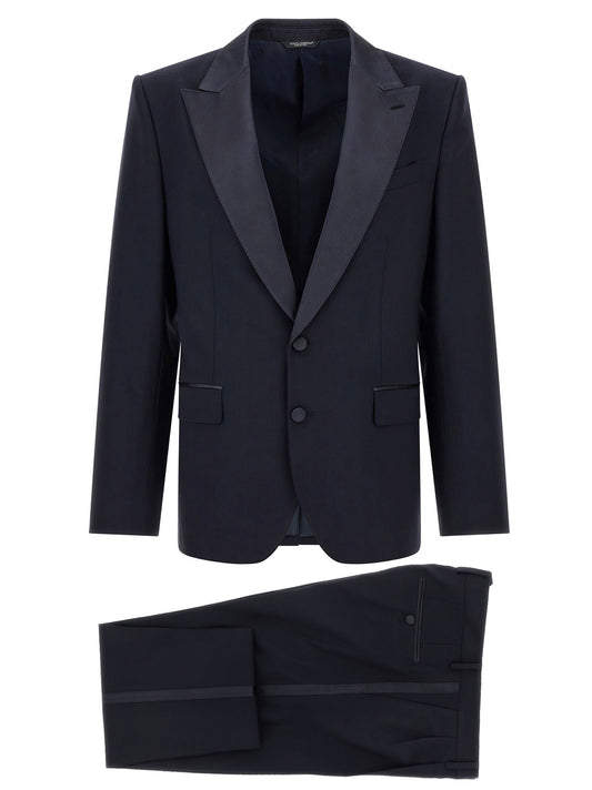 This Pant Suit by Dolce & Gabbana for men in polyester silk & virgin wool blue presents a discerning silhouette, featuring a sophisticated split neckline and a discerning for a refined and polished look.