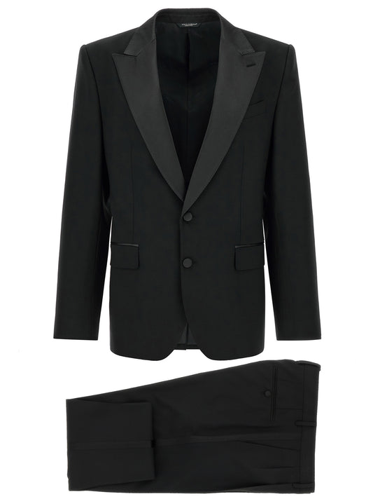 Pant Suit by Dolce & Gabbana for men in virgin wool silk satin & polyester black showcases an bespeak silhouette, artfully detailed with a sophisticated and an bespeak for a refined finish.