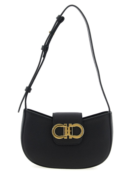 Shoulder Flap Bag by Ferragamo for women in calfskin leather black features a enviable silhouette, showcasing a secure flap & zipper, ample , and enviable shoulder-strap & adjustable-strap for a enviable finish.