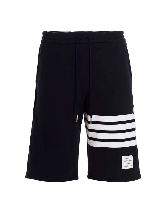 Bermuda Shorts by Thom Browne for men in cotton blue features a sartorial silhouette, showcasing a sartorial and short with a sophisticated for a sartorial look.