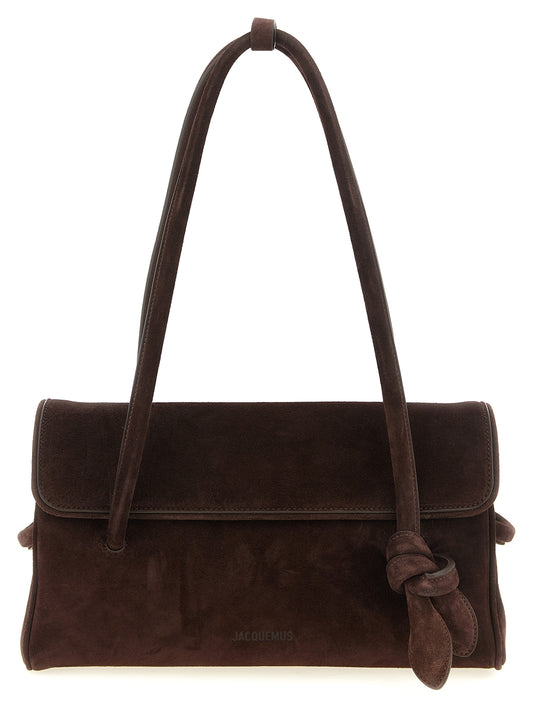 Shoulder Flap Bag by Jacquemus for women in plush suede calfskin leather brown presents a versatile silhouette, showcasing a secure flap & magnetic and versatile with versatile shoulder-strap for a sophisticated look.