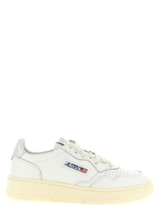 Sneakers by Autry for women in cowhide leather silver presents a sumptuous silhouette, artfully capturing the essence of the Women's Low Top Cowhide Leather Sneakers with its sumptuous low-top style design.