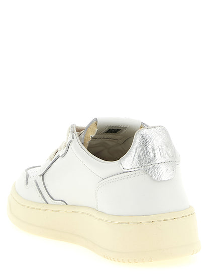 Sneakers by Autry for women in cowhide leather silver features a chic design, perfectly showcasing the chic low-top style of this Women's Low Top Cowhide Leather Sneakers.