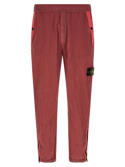 Joggers by Stone Island for men in nylon red features an sartorial regular-fit and long with a cut for a sartorial finish.