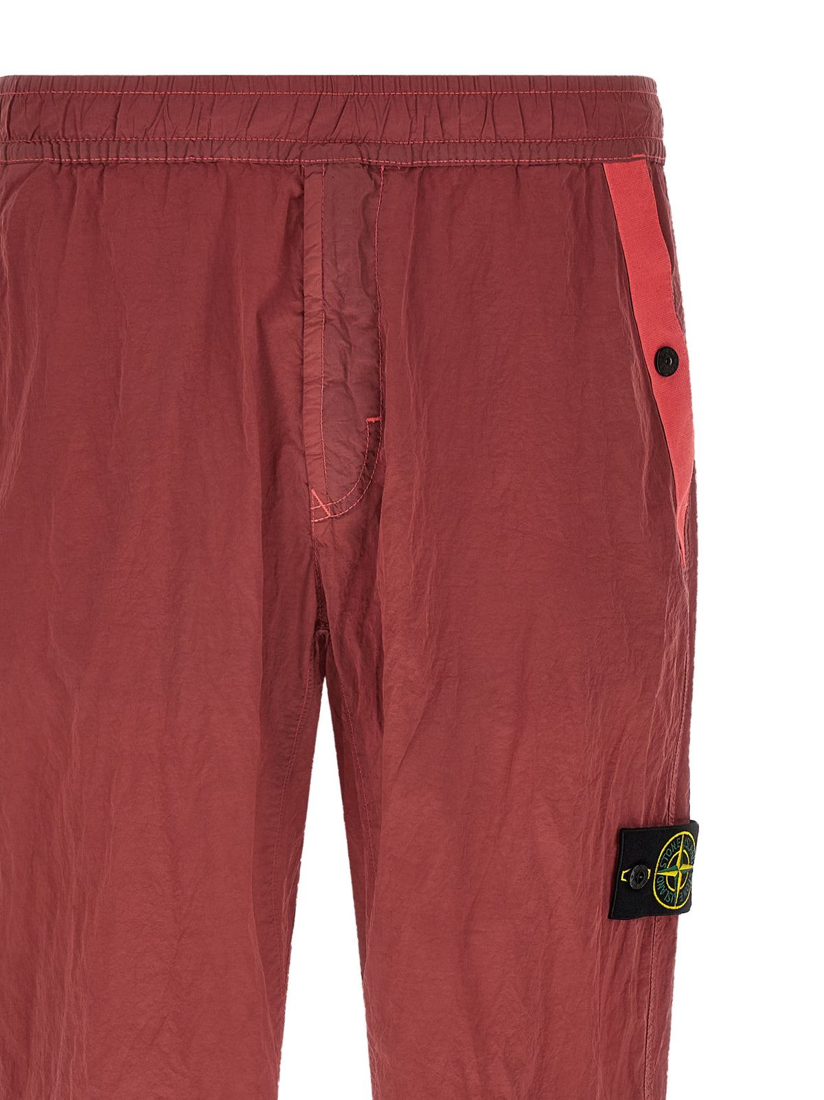 Joggers by Stone Island for men in nylon red features an sartorial regular-fit and long with a cut for a sartorial finish.