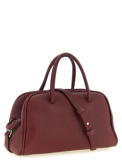 Bowling Handbag by Jacquemus for women in calfskin leather bordeaux & silver features a exquisite silhouette, showcasing a secure zipper and exquisite with versatile handle & adjustable-strap for a exquisite finish.