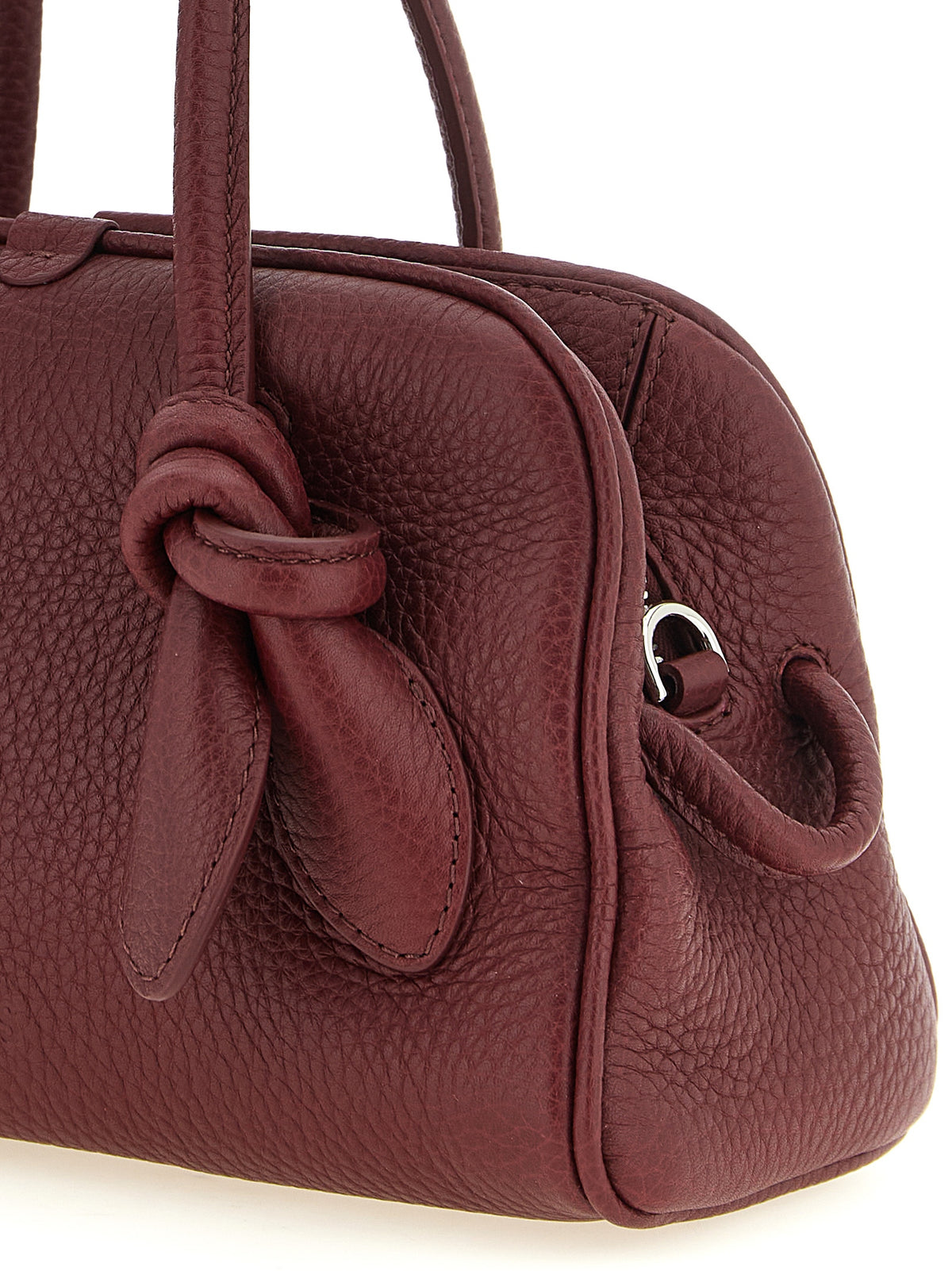 Bowling Handbag by Jacquemus for women in calfskin leather bordeaux & silver features a signature silhouette, showcasing a secure zipper and signature with versatile handle & adjustable-strap for a sophisticated look.
