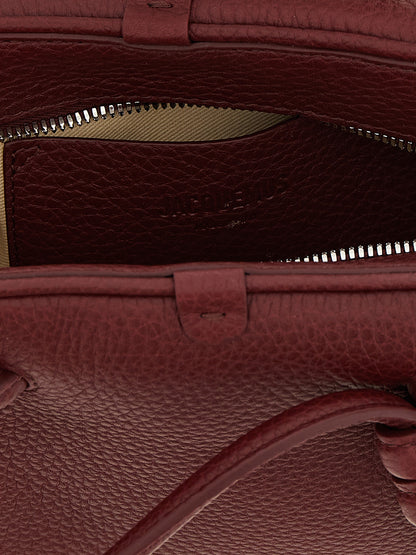Bowling Handbag by Jacquemus for women in calfskin leather bordeaux & silver features a refined silhouette, showcasing a secure zipper, organized , and versatile handle & adjustable-strap for a refined finish.