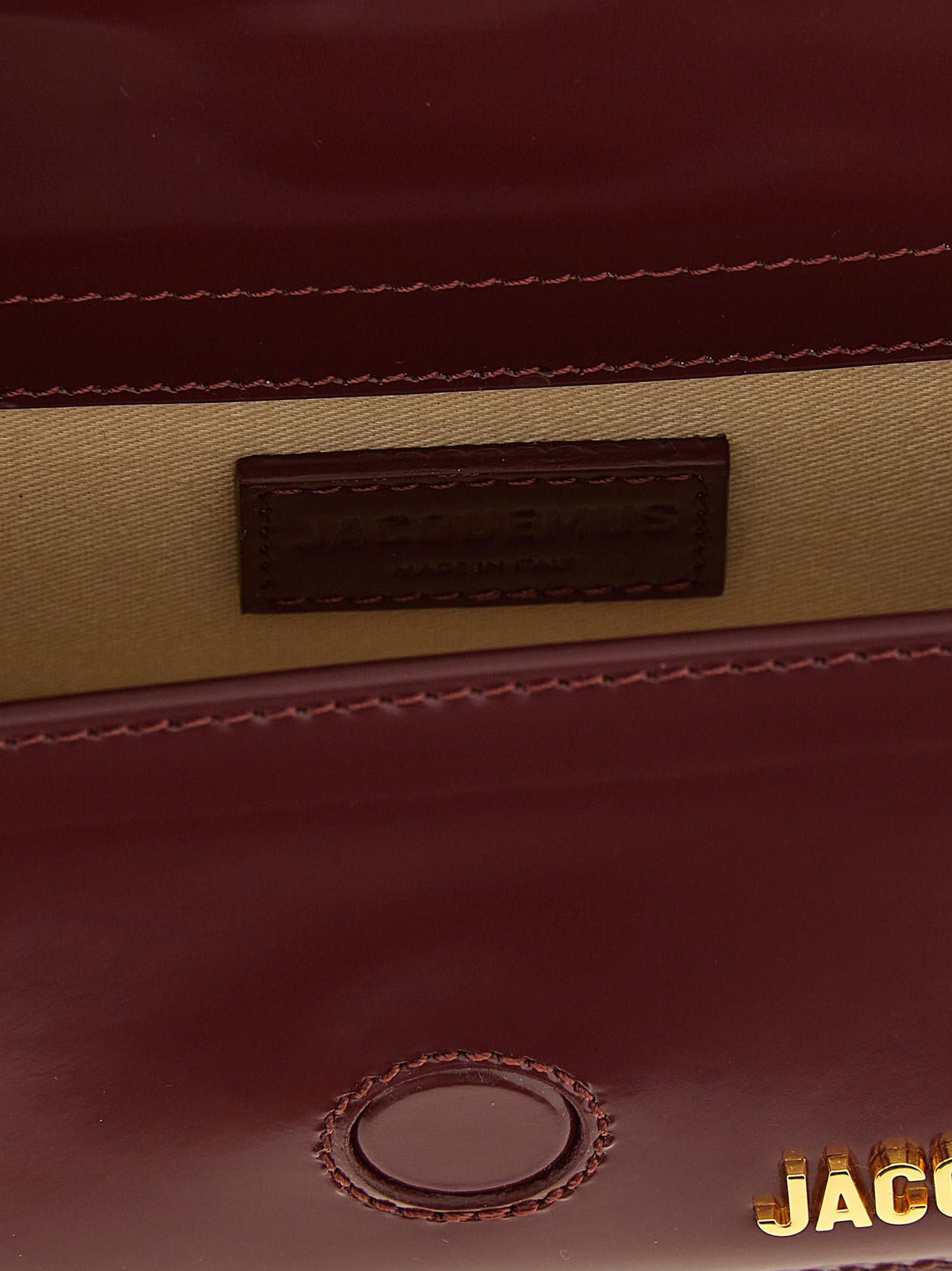 Handbag by Jacquemus for women in patent calfskin leather bordeaux & gold features a refined silhouette, showcasing a secure , organized , and versatile shoulder-strap & handle for a refined finish.