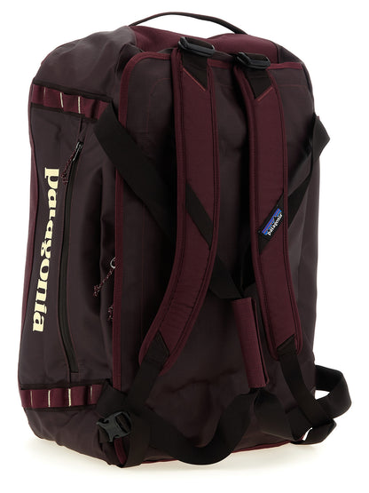 Travel Backpack by PATAGONIA for men in tu & polyester black & bordeaux showcases an architectural Black Hole TU & Polyester Travel Backpack design, featuring a secure , ample , and architectural backpack-strap, adjustable-strap & handle for a sophisticated look.