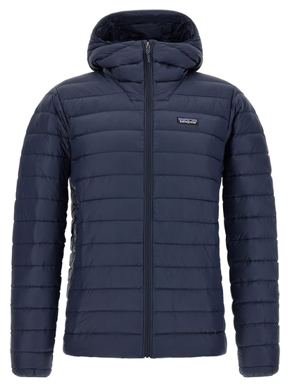 Hooded Puffer Jacket by PATAGONIA for men in nylon navy features a dramatic silhouette, showcasing a sophisticated hooded neckline and distinctive thermal, pockets, hooded & insulated for a dramatic aesthetic.