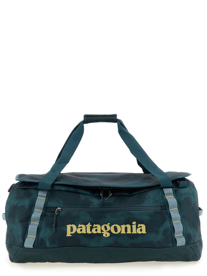 Travel Backpack by PATAGONIA for men in polyester & mesh black, light-blue, teal & patterned features a fashionable silhouette, showcasing the Black Hole Polyester & Mesh Travel Backpack design with a secure , ample , and versatile backpack-strap, adjustable-strap & handle.