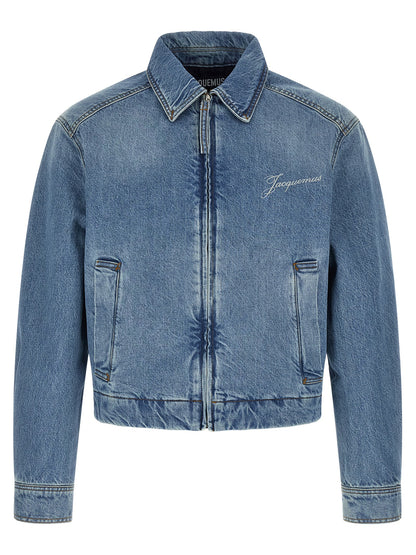 Trucker Jacket by Jacquemus for men in denim cotton blue & signature showcases a bohemian silhouette, artfully detailed with a bohemian and signature for a truly bohemian finish.