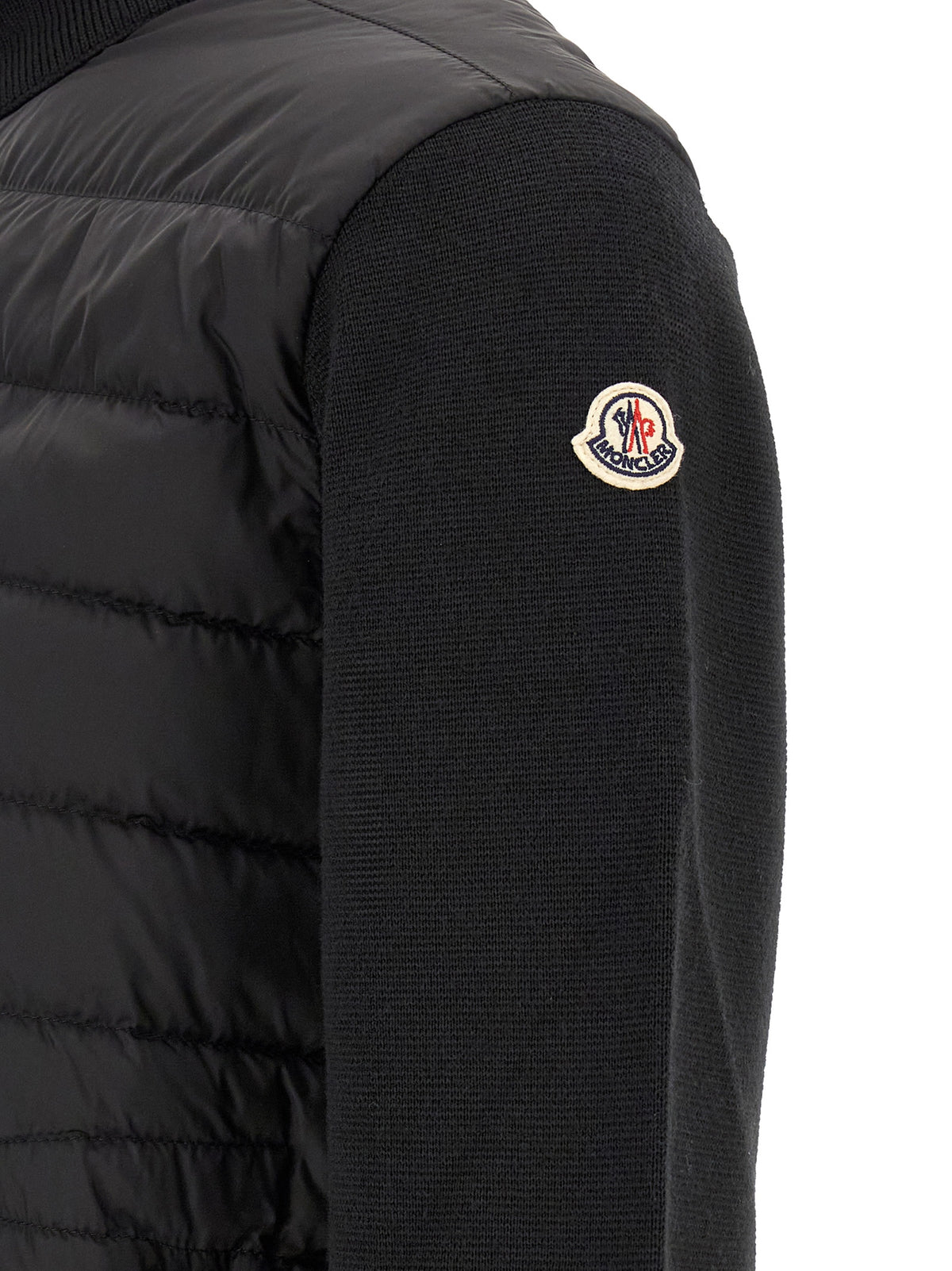 Cardigan by Moncler for men in virgin wool & polyamide black features an impeccable silhouette, showcasing a sophisticated and detail for a truly impeccable finish.