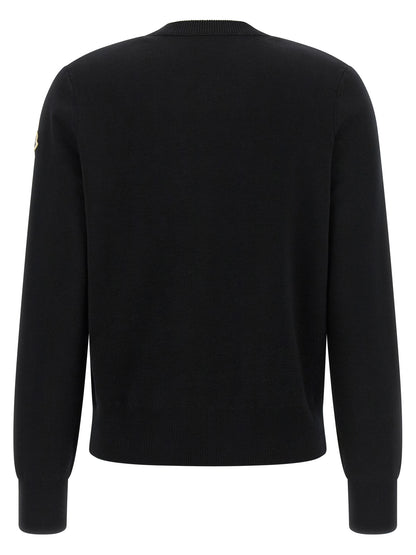 Cardigan by Moncler for women in felt polyamide & merino wool black & signature showcases a captivating silhouette, artfully detailed with a captivating and for a truly sophisticated captivating look.