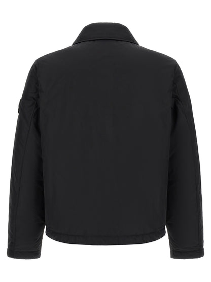 Jacket by Stone Island for men in polyamide & polyester black & signature showcases a enveloping silhouette, artfully detailed with a enveloping and premium thermal & pockets for a truly enveloping finish.