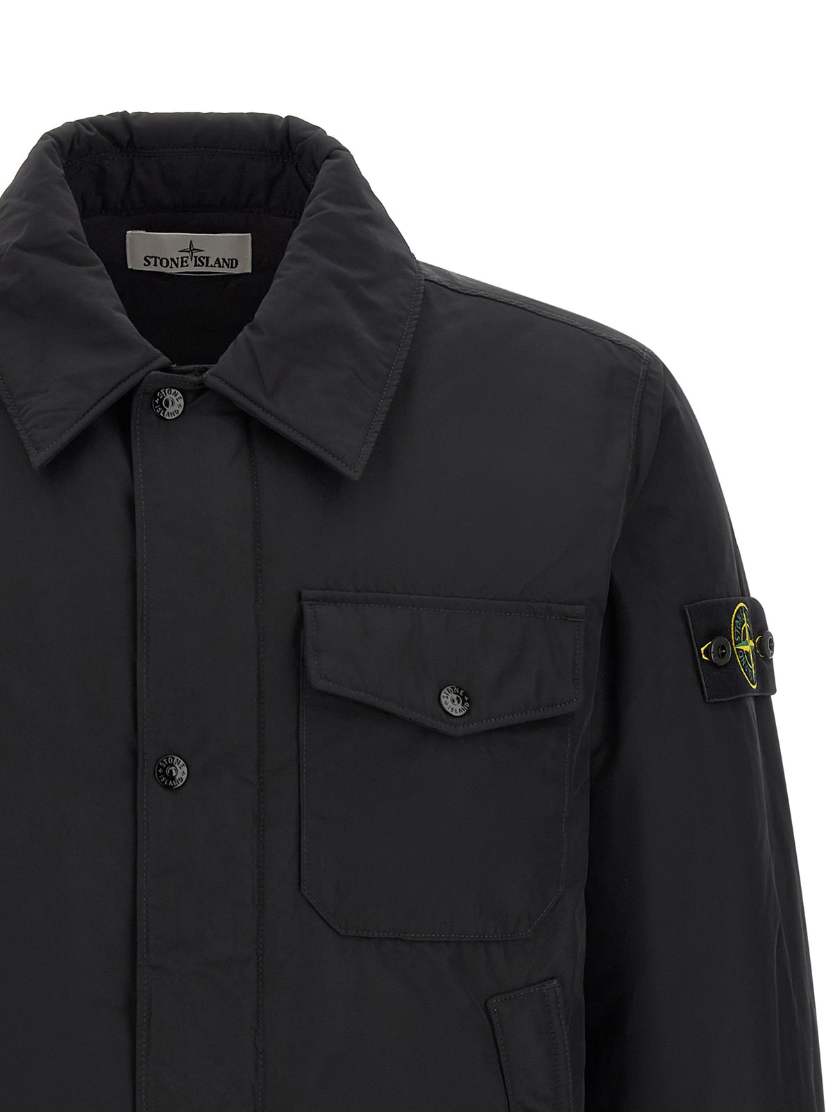 Jacket by Stone Island for men in polyamide & polyester black & signature features an utilitarian silhouette with a refined , showcasing sophisticated thermal & pockets for an utilitarian aesthetic.