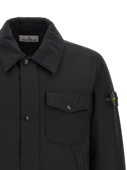 Jacket by Stone Island for men in polyamide & polyester black & signature features an utilitarian silhouette with a refined , showcasing sophisticated thermal & pockets for an utilitarian aesthetic.