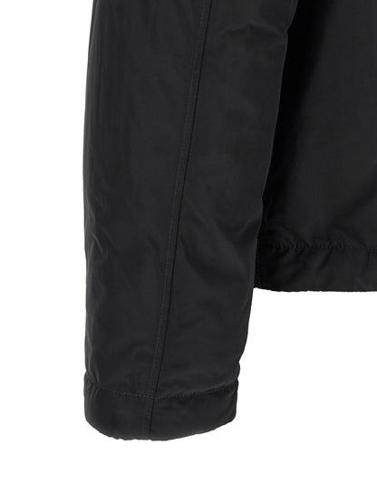Jacket by Stone Island for men in polyamide & polyester black & signature presents a authentic silhouette, artfully detailed with a authentic and functional thermal & pockets for a premium authentic finish.