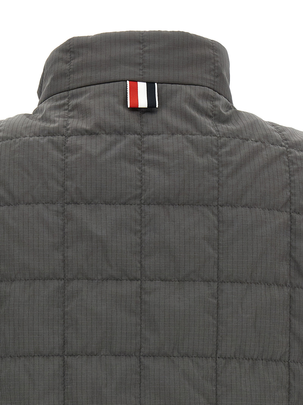 Vest by Thom Browne for men in metal polyamide & polyester dark-gray & patterned features an contemporary silhouette, showcasing refined and a contemporary for a sophisticated layered look.