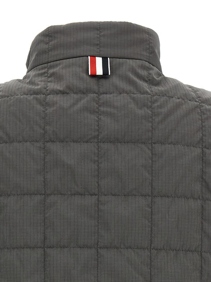 Vest by Thom Browne for men in metal polyamide & polyester dark-gray & patterned features an contemporary silhouette, showcasing refined and a contemporary for a sophisticated layered look.