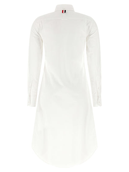 Skirt by Thom Browne for women in cotton white showcases a sultry silhouette, elegantly defined by its midi and the sophisticated sultry design of the Women's Tailored Cotton Midi Skirt.