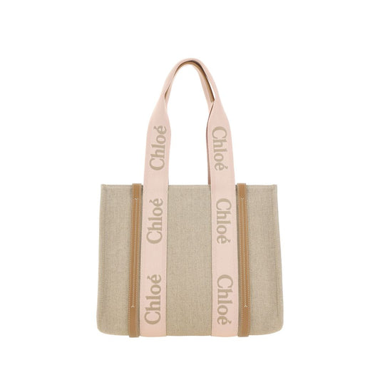 Shoulder Bag by Chloé for women in leather & linen brown & monogram features a effortless chic silhouette with a secure magnetic & button, ample , and versatile shoulder-strap & handle for a effortless chic finish.