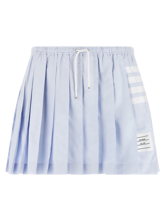 Skirt by Thom Browne for women in cotton light-blue, white, patterned, signature & striped showcases a dramatic silhouette, artfully capturing the essence of the Women's Pleated Tailored Cotton Mini Long Skirt in a dramatic mini long cut for a refined look.
