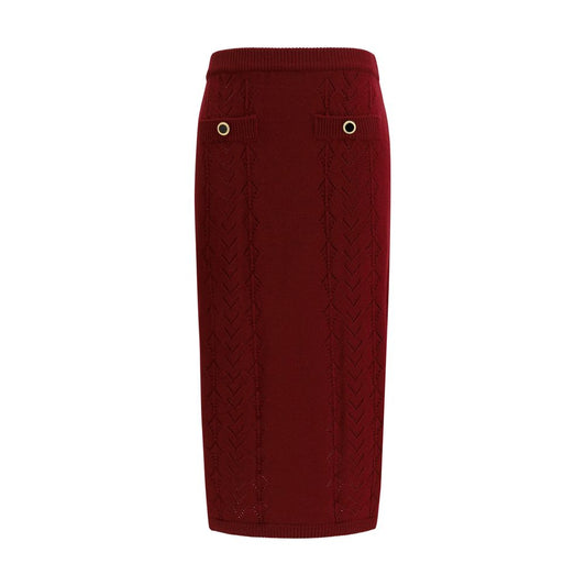 Skirt by Alessandra Rich for women in merino wool black, bordeaux & gold showcases a sultry silhouette, elegantly defined by its midi and the sophisticated sultry design of the Women's Merino Wool Midi Skirt.