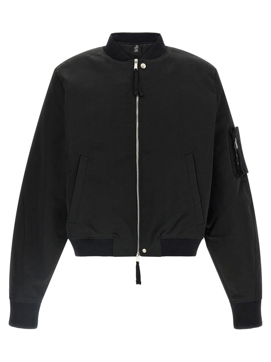 This Bomber Jacket by Thom Krom for men in polyamide black exhibits a edgy silhouette, meticulously detailed with functional pockets and a edgy for a edgy finish.
