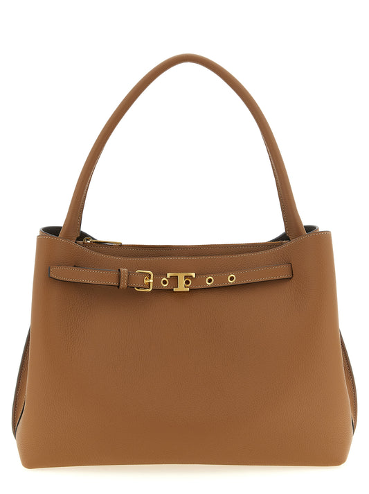 This Handbag by Tod's for women in bos taurus calfskin leather and brown, camel & gold presents a sculptural silhouette featuring a secure zipper & buckle, ample , and versatile handle for a sculptural finish.