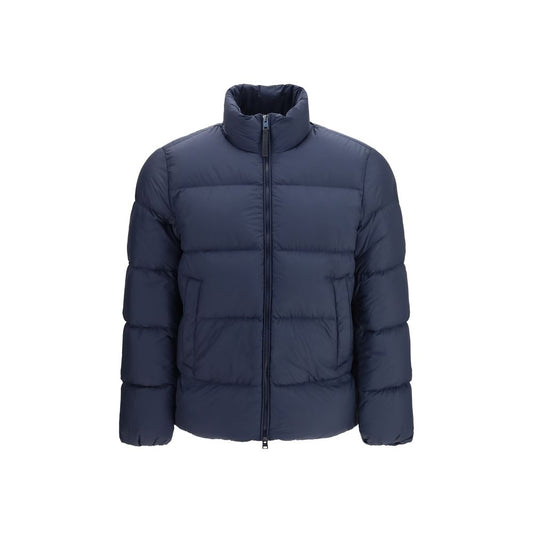 Overcoat by Woolrich for men in polyamide duck & goose down blue showcases a enveloping silhouette, detailed with distinctive thermal, pockets & insulated and a enveloping high-neck neckline.