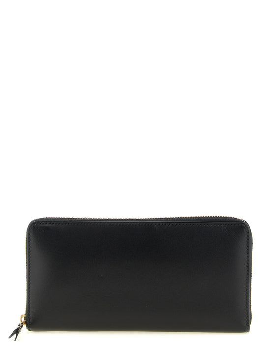 Cardholder Wallet by Comme Des Garçons for men in calfskin leather black & gold presents a refined silhouette, artfully capturing the essence of the Calfskin Leather Cardholder Wallet design with sophisticated card-organization compact-design zip-around for a refined look.