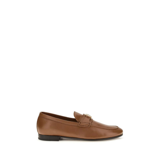 This Flat Loafer Slip-On Strap Shoes by Valentino Garavani for women in nappa leather brown, gold & signature features an exquisite silhouette from the V Logo Women's Nappa Leather Flat Loafer Slip-On Strap Shoes collection, defined by a sophisticated flat and elegant .