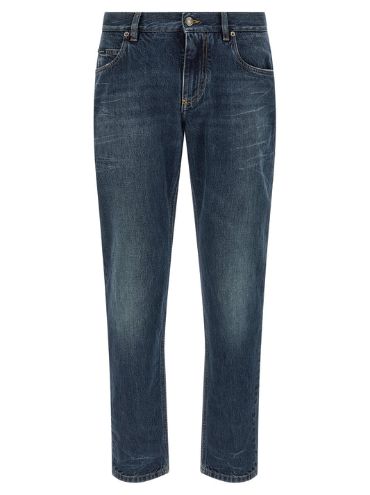 Jeans by Dolce & Gabbana for men in cotton denim blue & signature presents a tailored silhouette, showcasing a tailored straight-leg and long cut with a refined low rise for a truly tailored aesthetic.